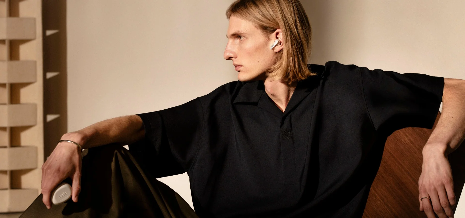Sudio TWS earbuds on a male model